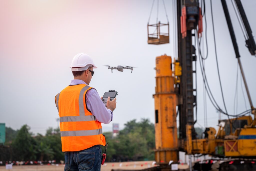 Engineer construction used drone take photo aerial view for inspection and survey at construction si