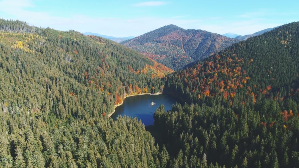 mountain calm blue lake among forestry hills in highland